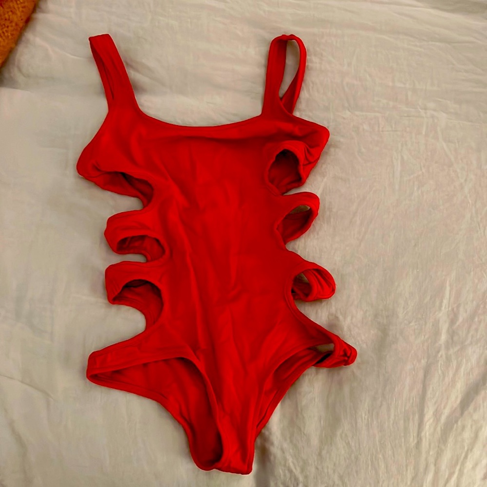 Red one piece with side cutouts